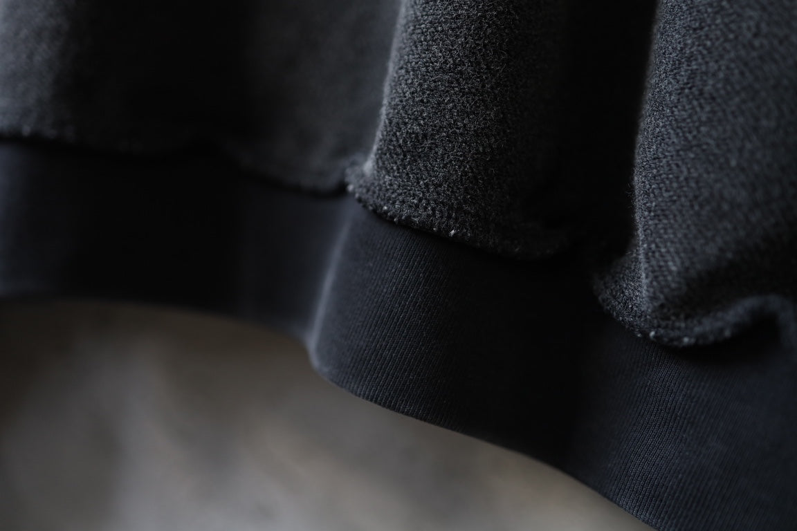 Balenciaga black sweatshirt cuff and hem detail with ribbed knit edge