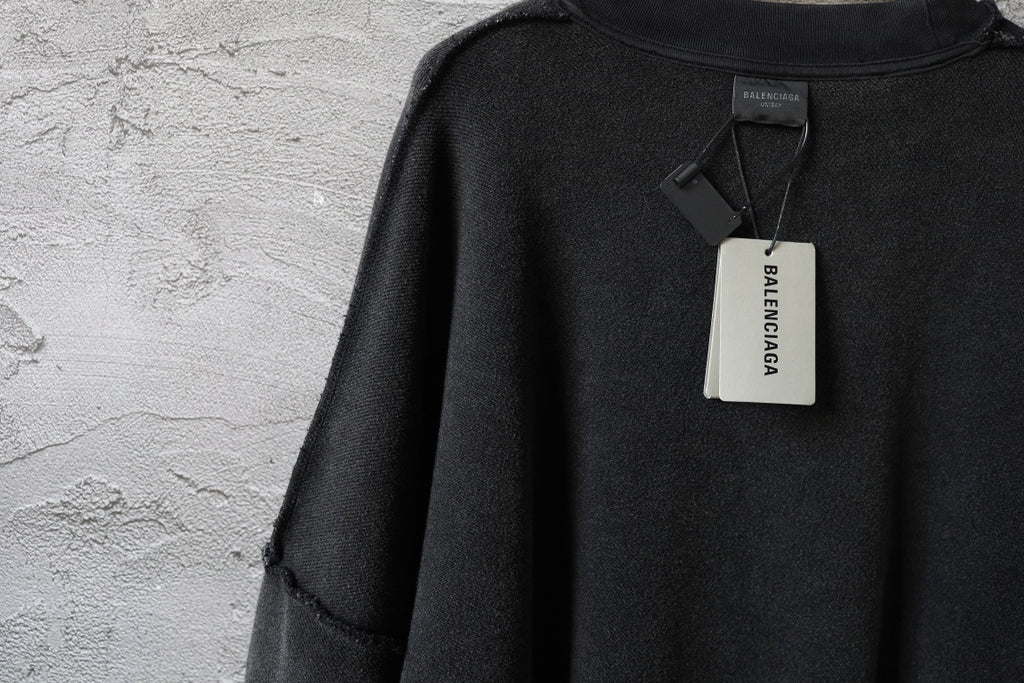 Balenciaga black long-sleeve sweatshirt with hanging neck tag