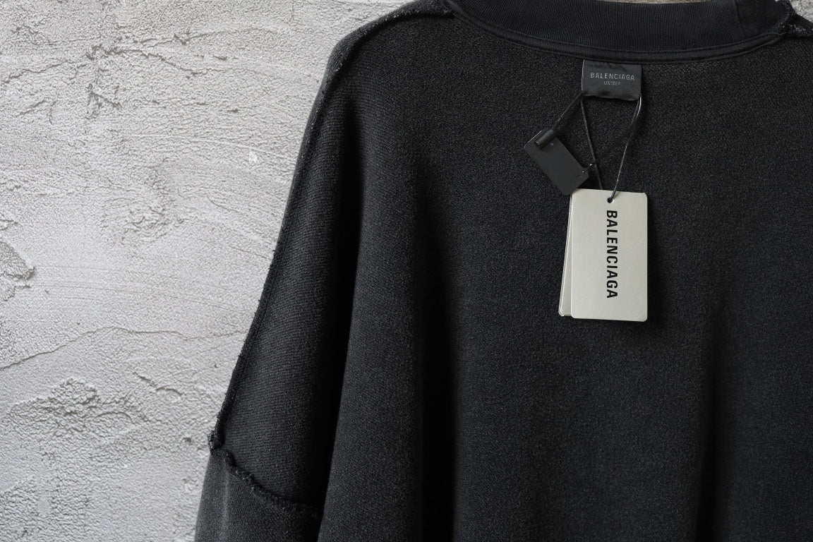 Balenciaga black long-sleeve sweatshirt with hanging neck tag