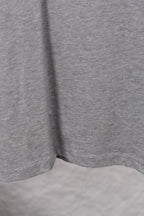 Dior long-sleeve crewneck top hem and side view in heather gray jersey knit