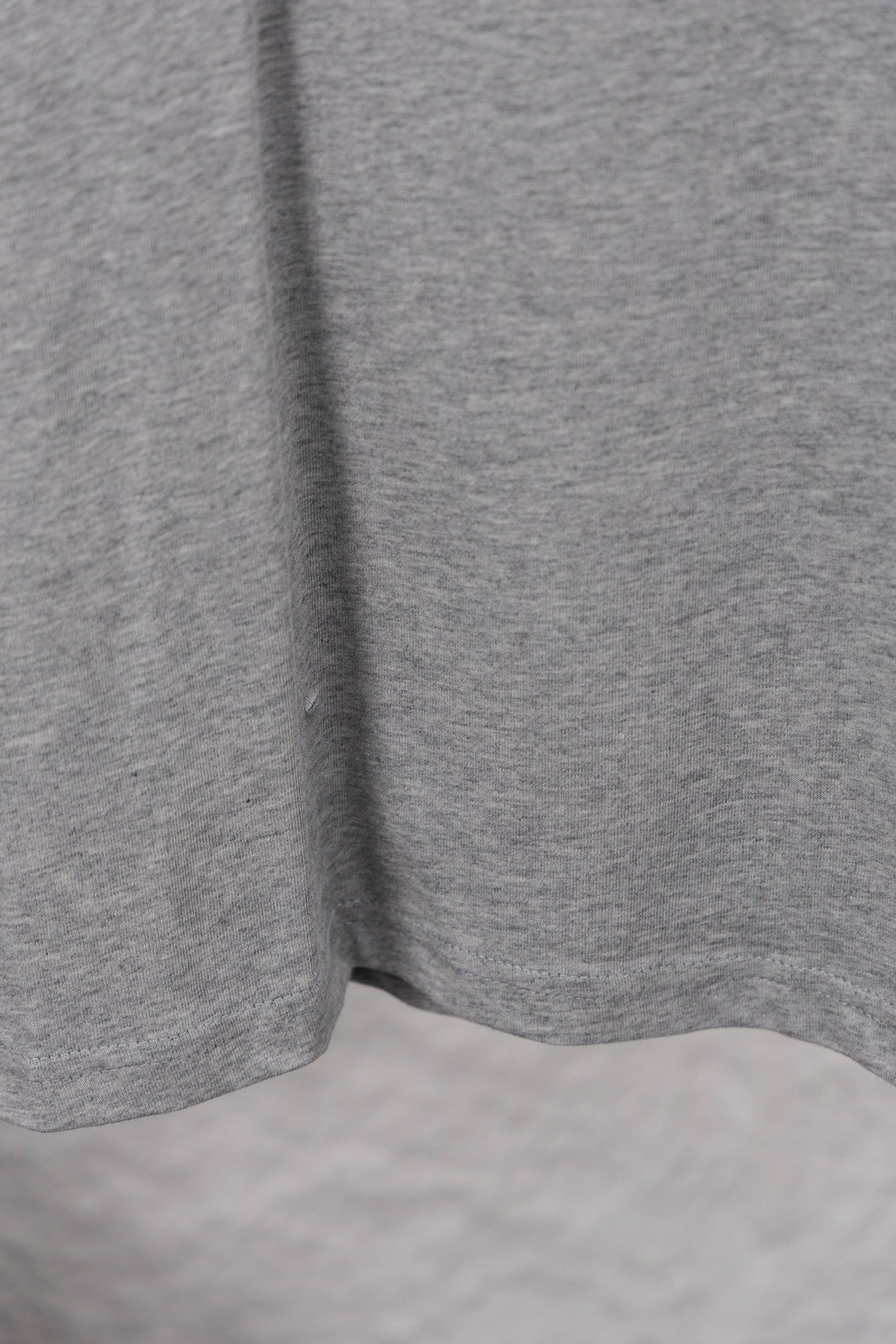 Dior long-sleeve crewneck top hem and side view in heather gray jersey knit