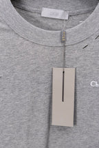 Dior long-sleeve crewneck top neckline with zipper tag; heather gray fabric close-up