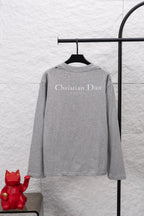Dior long-sleeve crewneck top in heather gray, back features “Christian Dior” print