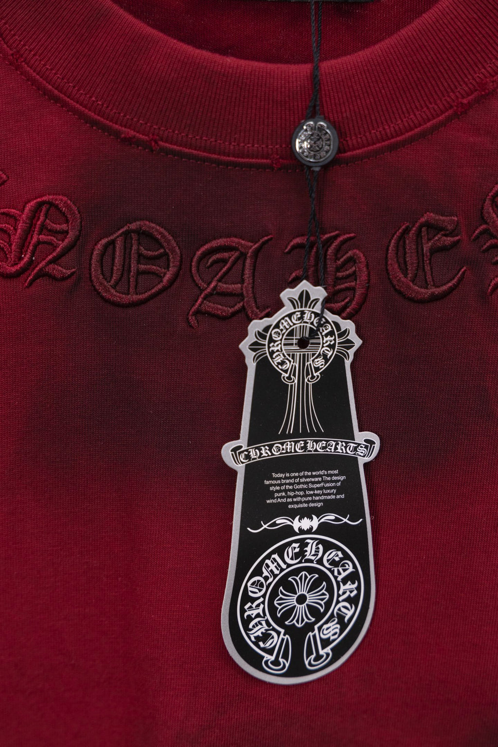 Red long-sleeve shirt with ribbed collar and hanging product tag