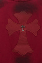 Red long-sleeve shirt closeup of large embroidered cross and silver-styled center