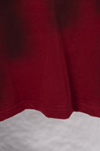 Red long-sleeve shirt with straight hem and visible seam stitching at bottom