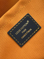Louis Vuitton leather patch tag on multicolor bag lining