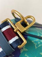 Louis Vuitton multicolor bag clasp with gold hardware and striped strap