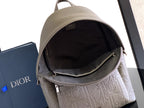 Dior mini backpack open top in light gray with dark fabric interior and zipper