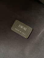Dior men's backpack interior label reading DIOR MADE IN ITALY