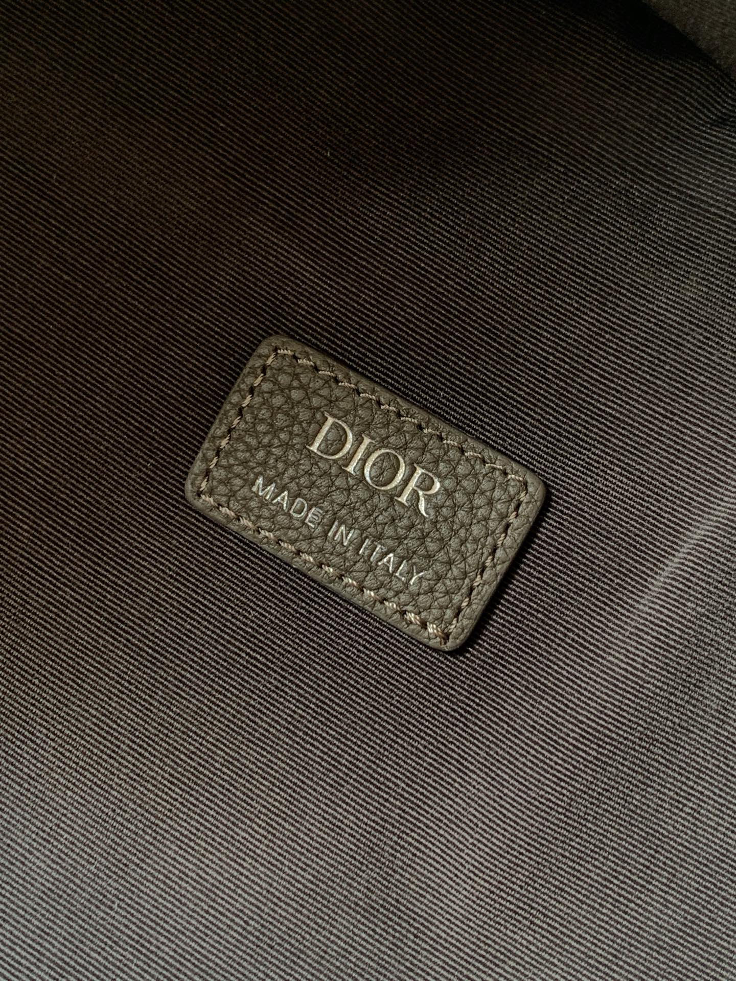 Dior mini backpack interior label reading “DIOR” and “MADE IN ITALY”