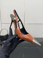 Women’s high-heel slingback pump in orange patent with black heel and silver YSL emblem