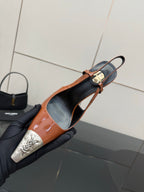 Women’s high-heel slingback pump with orange patent upper, black lining, and silver toe tips