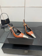Women’s high-heel slingback pumps in orange patent with black panels and silver toe tips
