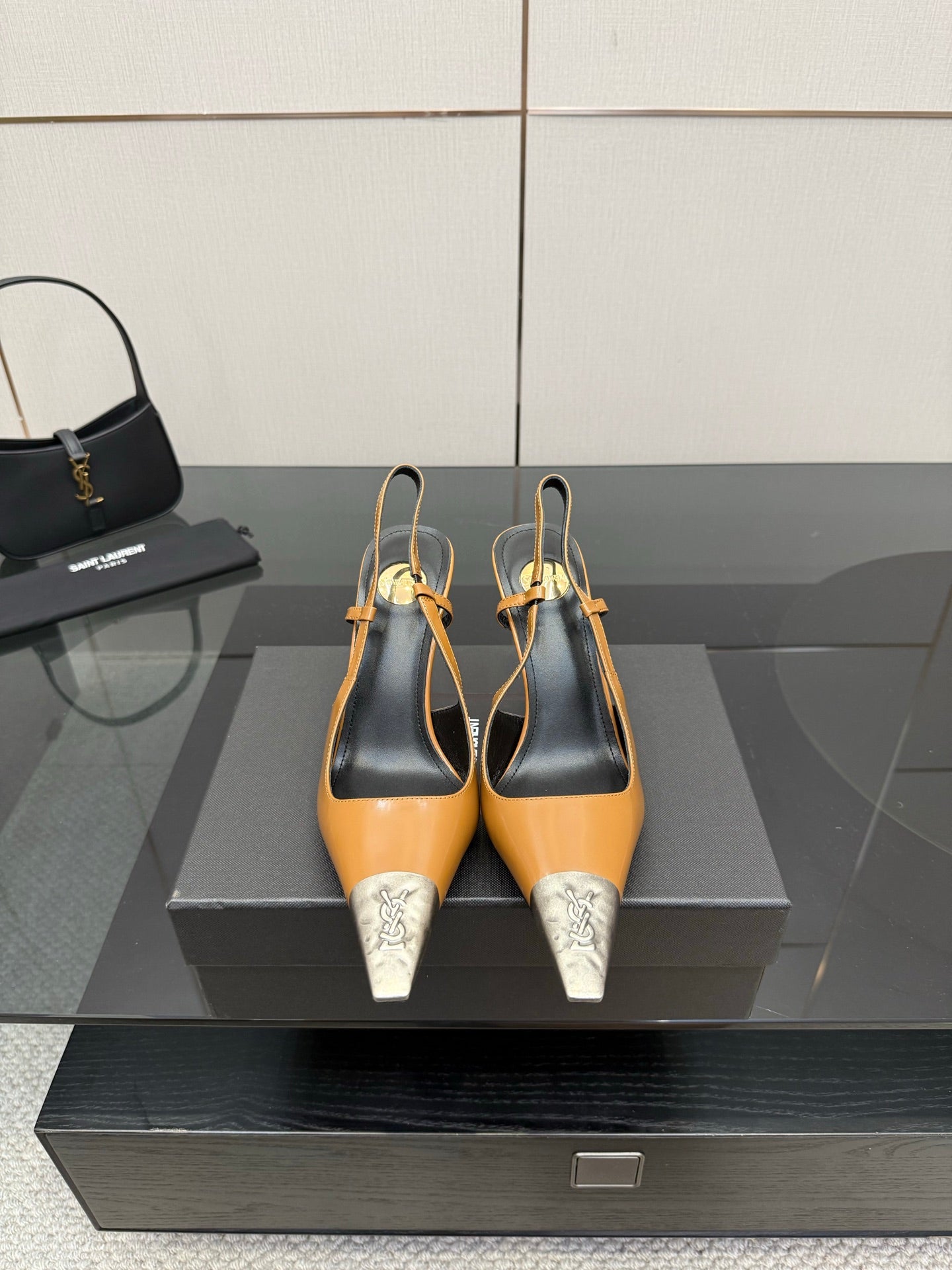 YSL womens heels with tan upper, black slingback, and silver pointed toe caps