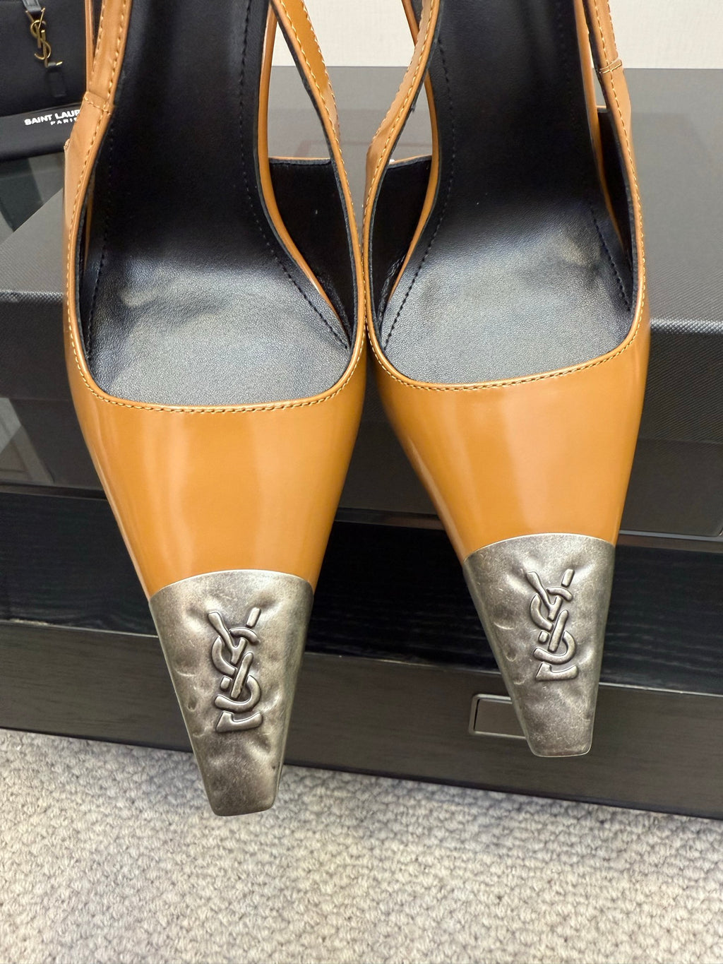 YSL womens slingback heel close-up: tan leather with silver logo toe caps