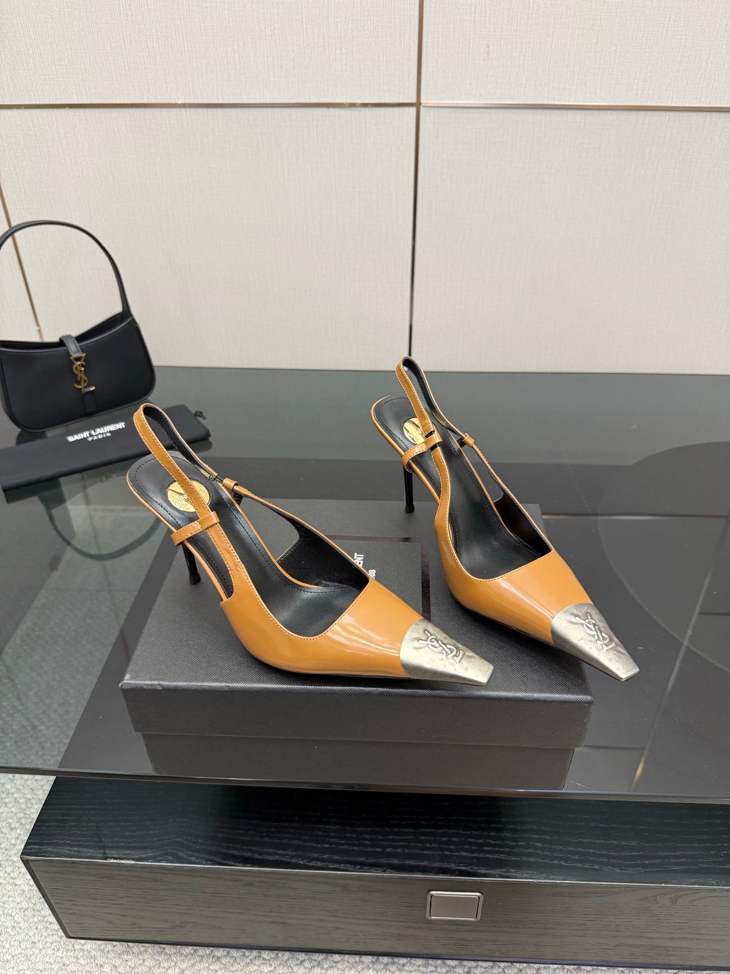 YSL womens slingback heels with tan leather straps, black lining, and silver toe tips