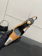 YSL womens slingback heels close-up with tan leather, black insole, and silver toe cap