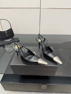 Women's YSL black slingback pumps with gold-logo tips and stiletto heels