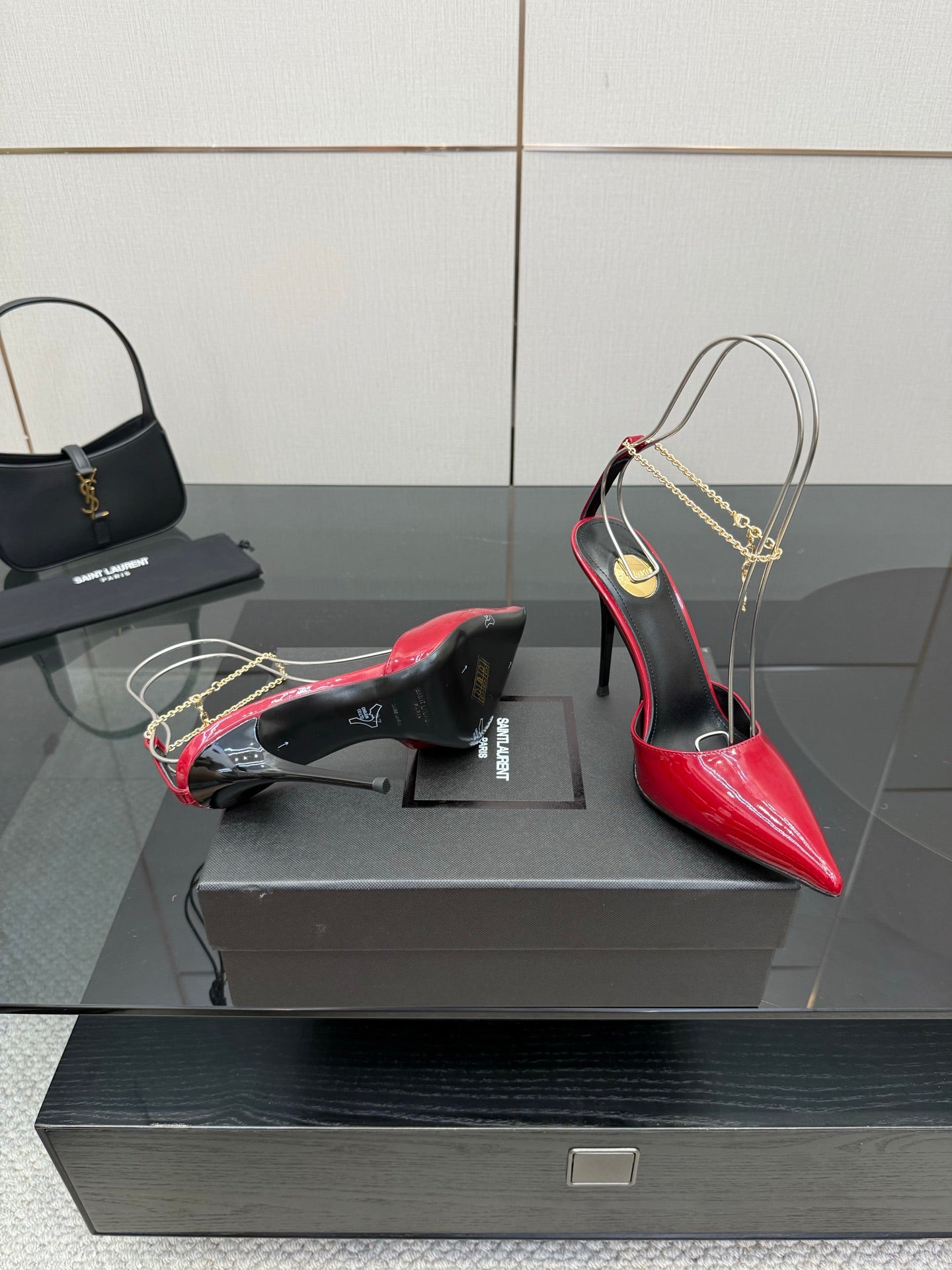 Women’s red patent pointed-toe stiletto heel, side view with black lining