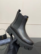 Prada black leather ankle boots with elastic gore and chunky tread sole