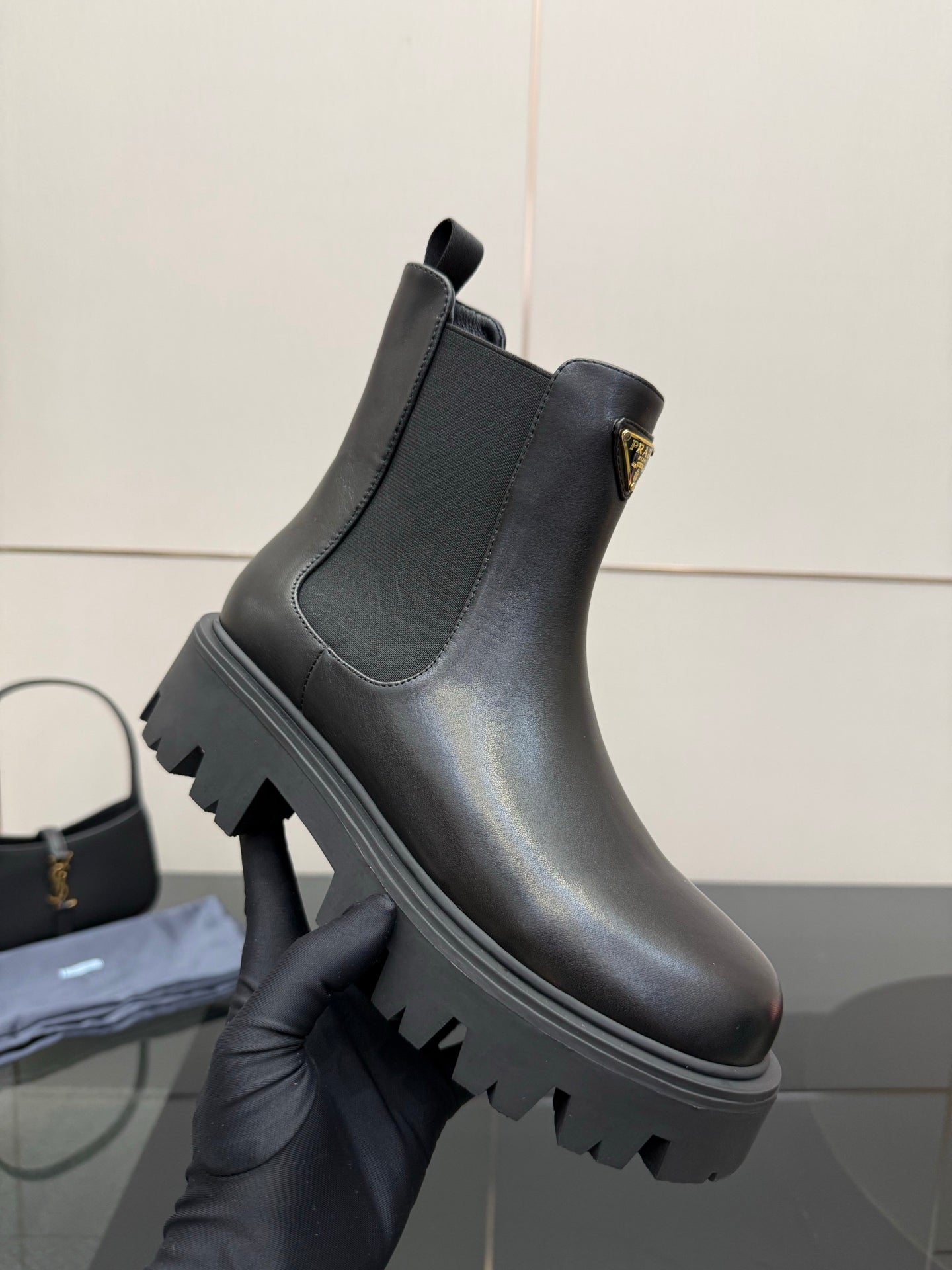 Prada black leather ankle boots with elastic gore and chunky tread sole