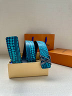 Louis Vuitton belt with turquoise dot strap and gold LV buckle, plus extra strap
