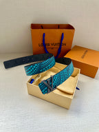 Louis Vuitton belt with turquoise dot strap and gold LV buckle, folded