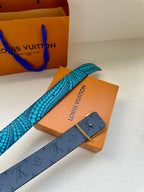 Louis Vuitton belt with turquoise dot strap and gold buckle, with small keeper