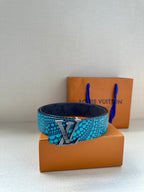 Louis Vuitton belt with turquoise dot strap and gold LV buckle, dark monogram back
