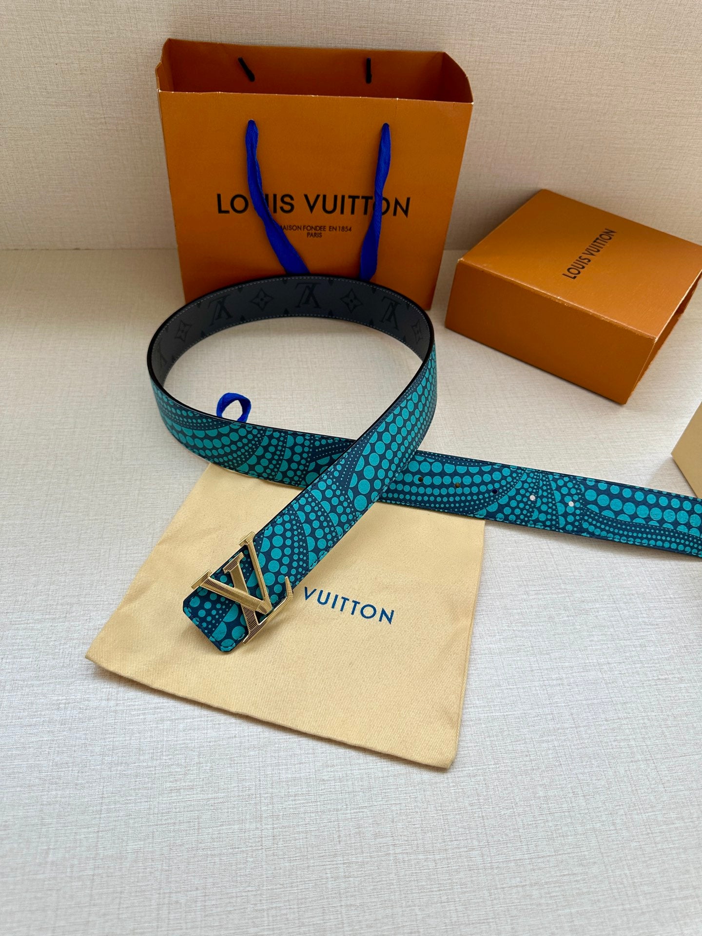 Louis Vuitton belt, turquoise dotted print with silver LV buckle and dark lining