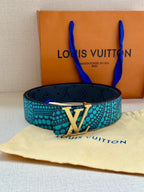 Louis Vuitton belt with turquoise dotted band and gold-tone LV buckle