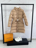 Tan long puffer coat with hood, front zip, and detachable belt