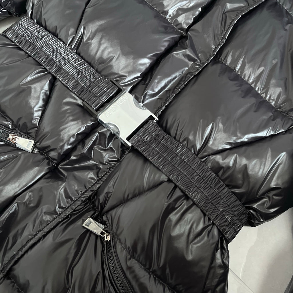 Front zipper and ribbed strap with snap tabs on dark gray puffer jacket