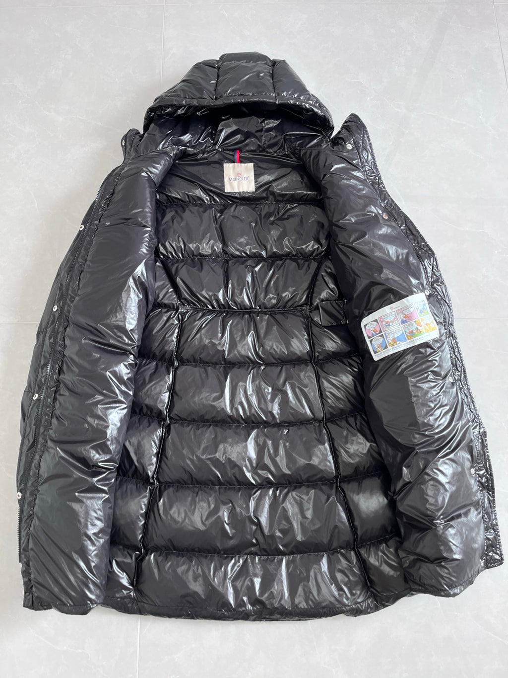 Long hooded puffer jacket with quilted insulation, dark gray exterior