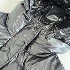 Dark gray puffer jacket hood and front placket with snap details