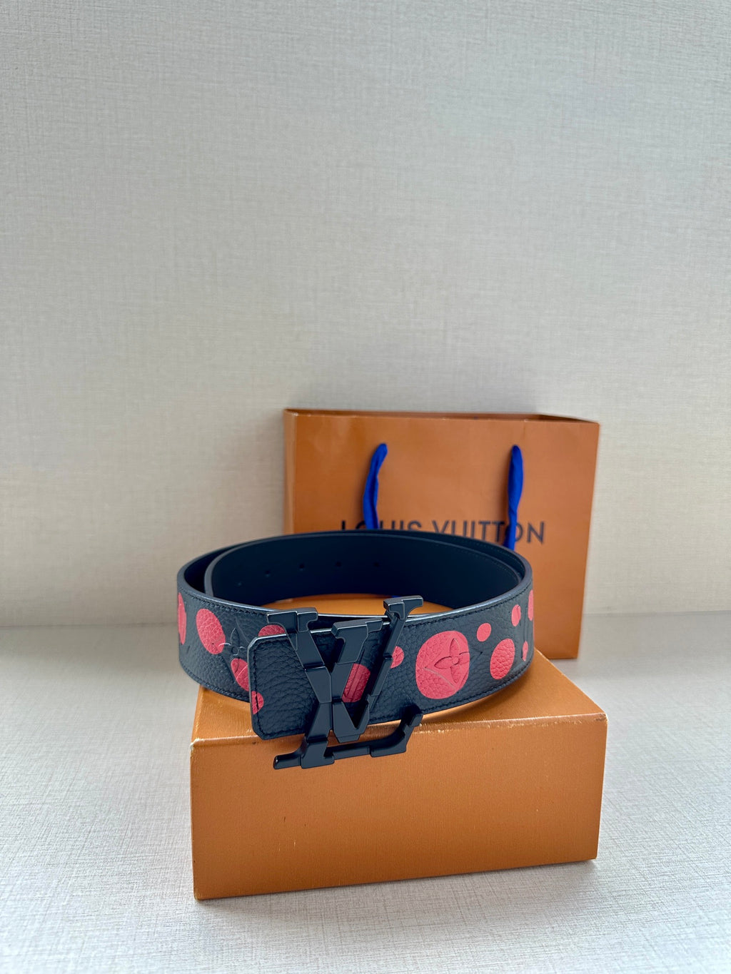 Louis Vuitton belt, dark blue strap with red circle pattern and silver buckle