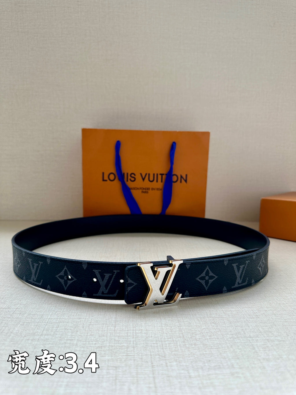 Louis Vuitton monogram belt in dark blue with gold-tone buckle and adjustable holes