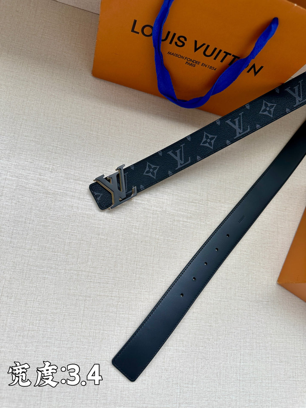 Louis Vuitton dark blue belt with monogram strap and gold-tone buckle hardware