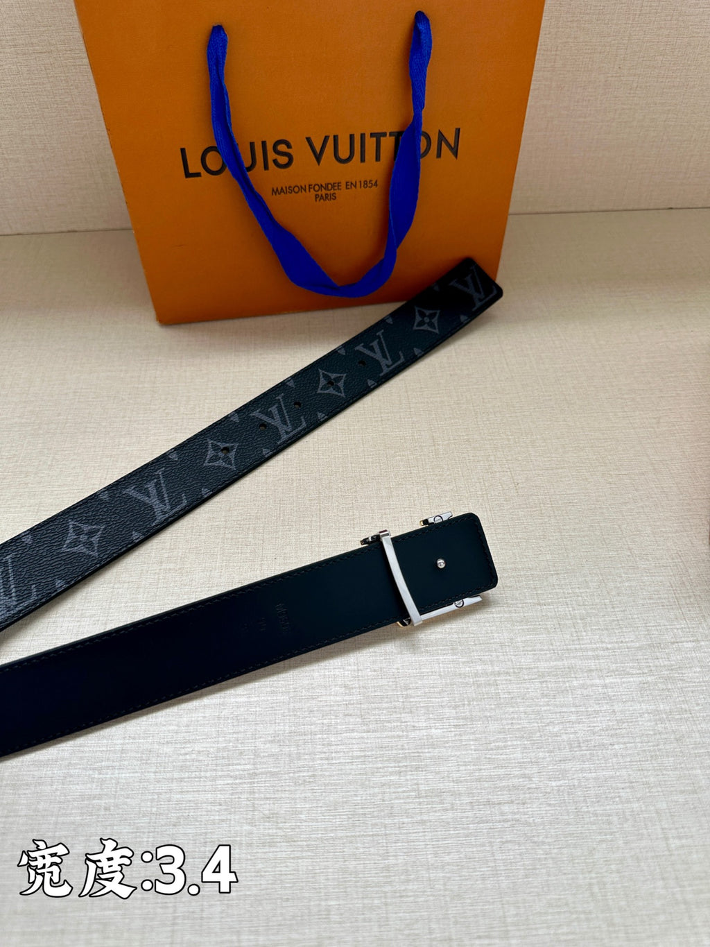 Louis Vuitton dark blue belt with monogram pattern and rectangular metal buckle