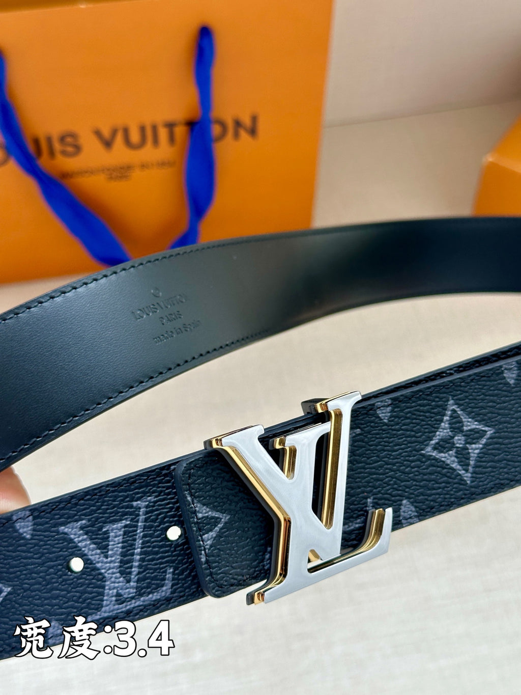 Louis Vuitton dark blue belt with monogram pattern and gold-tone V-shaped buckle