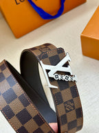 Louis Vuitton belt side view: dark check canvas with gold buckle and inner black lining
