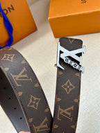 Louis Vuitton belt with dark monogram strap and silver-tone buckle close-up