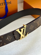 Louis Vuitton belt close-up with gold buckle and dark brown monogram strap