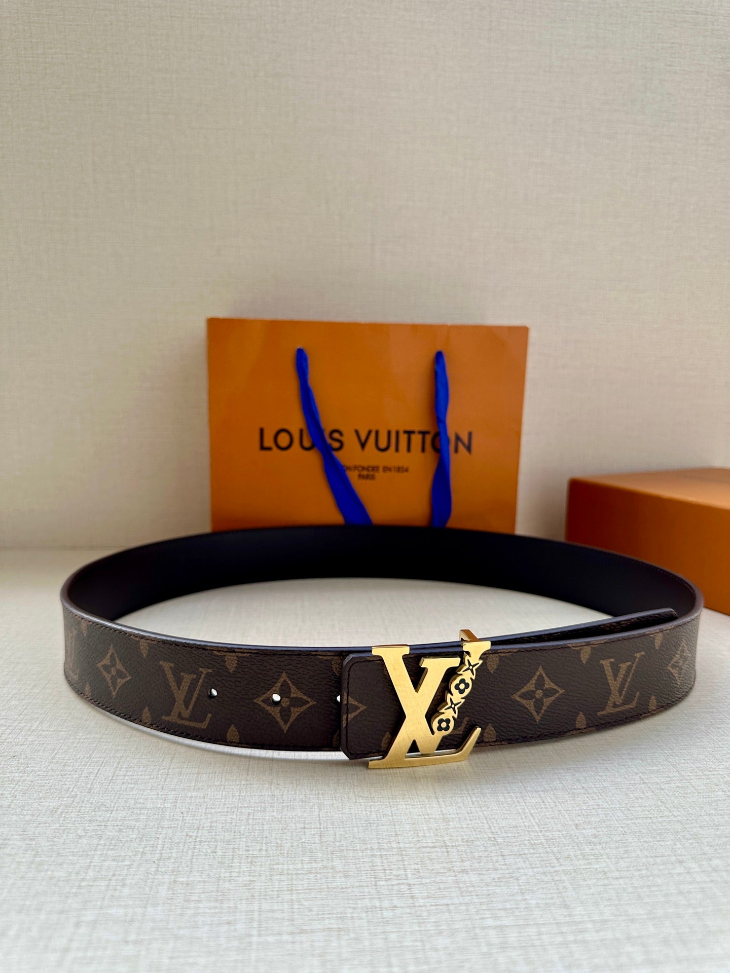 Louis Vuitton monogram belt with gold-tone buckle, dark brown canvas strap