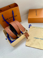 Louis Vuitton belt with light tan leather strap and gold V buckle