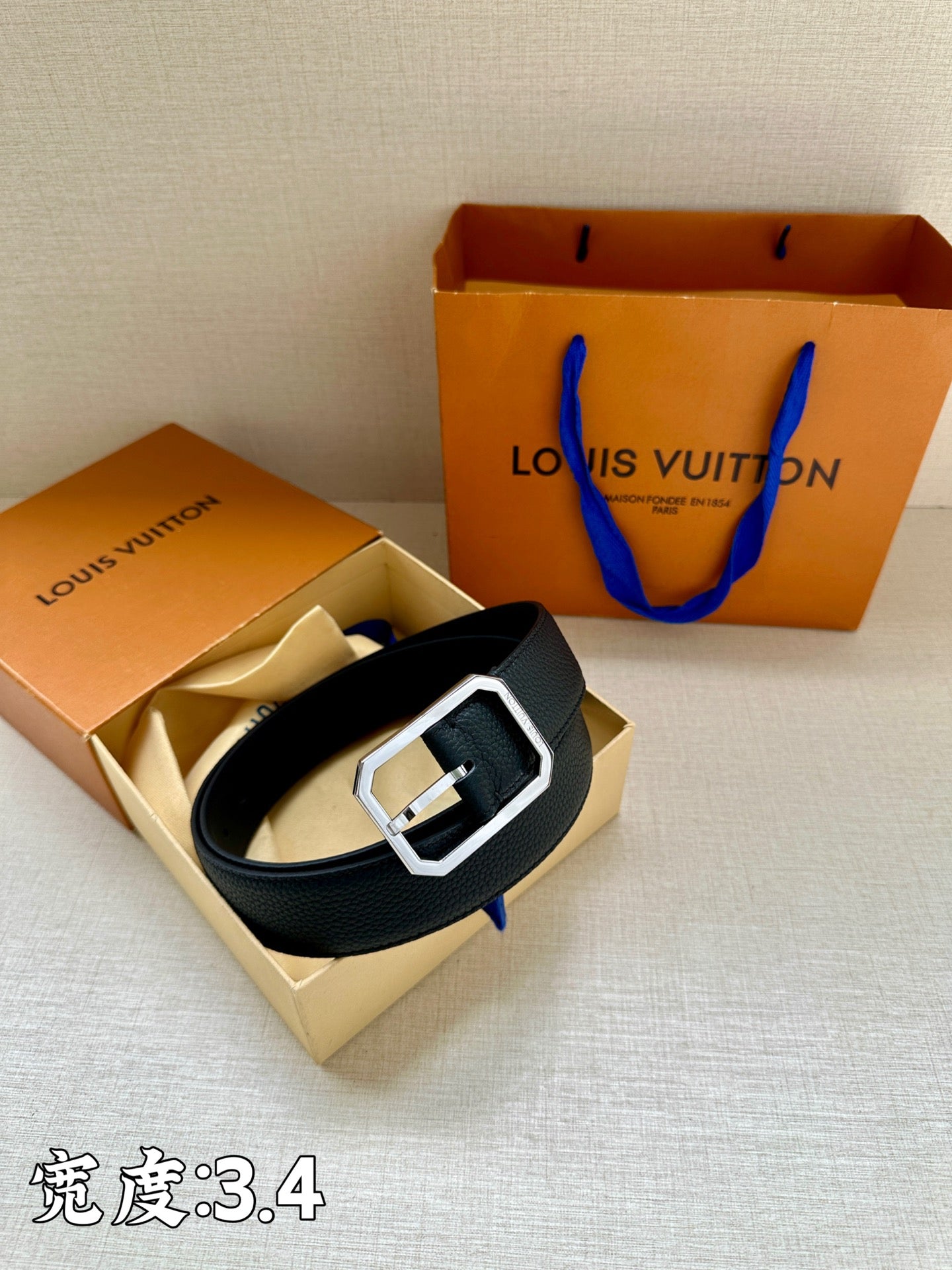 Louis Vuitton leather belt with dark blue strap and silver-tone square buckle