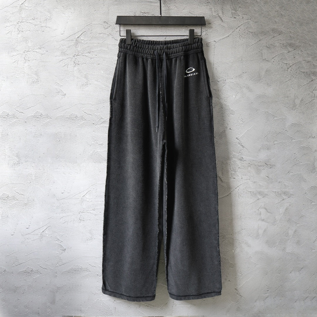 Balenciaga dark pants with elastic waistband and drawstring, wide-leg