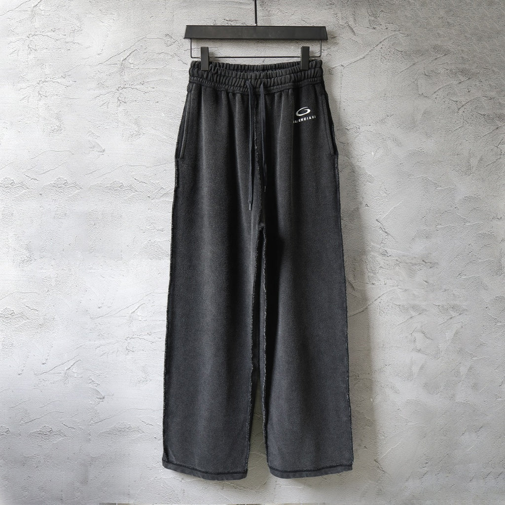 Black Balenciaga wide-leg pants with elastic waistband and drawstring