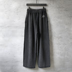 Black Balenciaga wide-leg pants with elastic waistband and drawstring